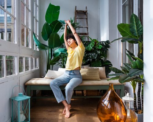 Beautiful latino young woman at home - Pretty south american with curly hair female portrait, lifestyle and domestic life scene